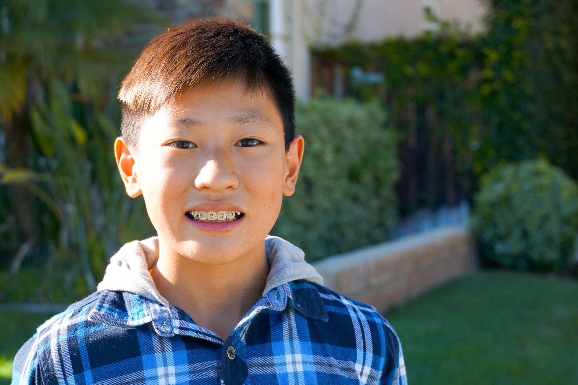 Portrait of young Asian boy with tooth braces. Young teen boy smiling and showing his orthodontic braces on his teeth. Portrait of young Asian boy with tooth braces. Young teen boy smiling and showing his orthodontic braces on his teeth.
